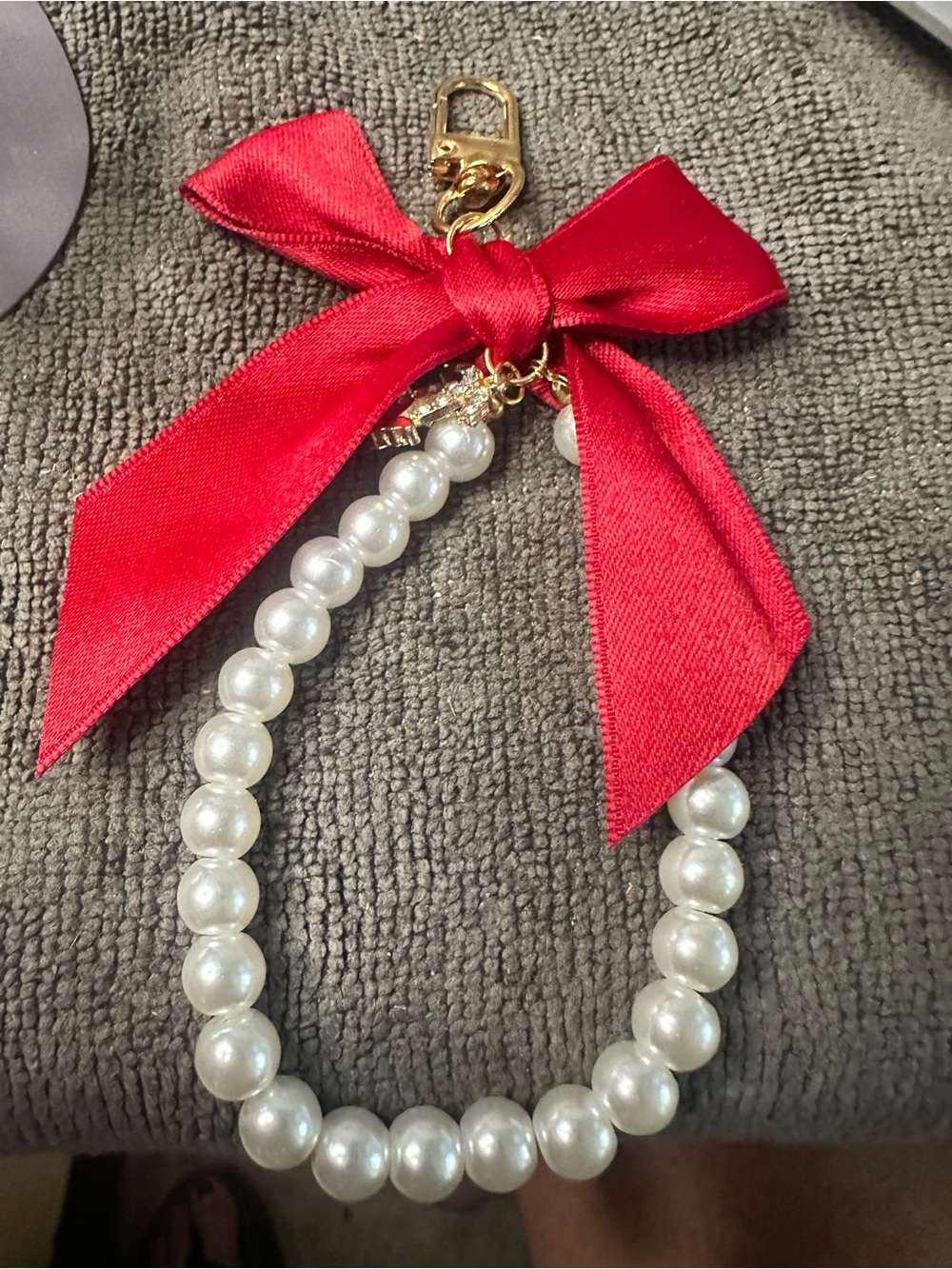 Elegant Pearl Bracelet with Red Bow Accent purse charm